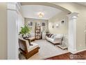 Cozy living room with bright natural light, plush carpeting, and decorative furniture at 12214 Roslyn St, Thornton, CO 80602