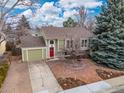 Charming single-Gathering home features an attached garage, and manicured front yard at 138 S Washington Ave, Louisville, CO 80027