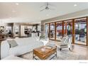 Open-concept living area with hardwood floors leading to a sliding door and outdoor patio, creating seamless indoor-outdoor living at 2050 Oak Ave, Boulder, CO 80304