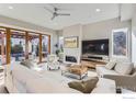 Bright living room boasts a fireplace, large windows with an access to the outdoor area at 2050 Oak Ave, Boulder, CO 80304