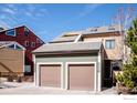 Three detached garages for townhomes in an earthy palette. Each garage corresponds with the townhome it's for at 2885 Springdale Ln, Boulder, CO 80303