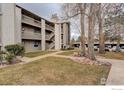 Apartment building featuring multiple balconies, green spaces, and covered parking at 3525 28Th St # 304, Boulder, CO 80301