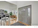 Inviting foyer showcasing a stylish front door and an open layout leading to the living room at 366 Blackhawk Ln, Lafayette, CO 80026