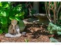 Zen garden featuring a Buddha statue, bird bath and lush greenery creating a tranquil outdoor space at 531 Arapahoe Ave, Boulder, CO 80302