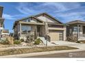 Charming home featuring modern architecture and a well-manicured front yard at 5626 Four Leaf Dr, Longmont, CO 80503