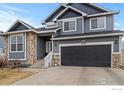 Attractive two-story home with stone accents and a spacious two-car garage at 5786 Valley Vista Ave, Firestone, CO 80504