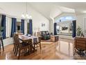 Spacious dining area featuring a table for six and many windows at 908 Cinnamon Ln, Louisville, CO 80027