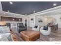 Spacious open-concept living area seamlessly connects to the kitchen and dining spaces at 1079 Larkspur Dr, Erie, CO 80516