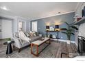 Relaxing living room with modern decor, comfortable seating, and a fireplace, perfect for entertaining at 12450 E Cornell Ave # 304, Aurora, CO 80014