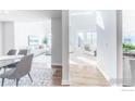 Bright hallway offering views to the dining room and living room with natural light at 1699 N Downing St # 409, Denver, CO 80218