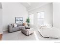 Modern living room with neutral tones, comfortable seating, and ample natural light at 1699 N Downing St # 409, Denver, CO 80218