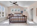 Spacious main bedroom with large windows, plantation shutters, vaulted ceiling, and a ceiling fan for added comfort at 462 Blue Lake Trl, Lafayette, CO 80026
