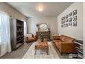 Cozy living room with neutral tones, stylish furniture, and bright natural light at 6834 Blue Spruce St, Frederick, CO 80530