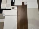 Design selections showcasing flooring, countertops and tile options for modern kitchen and bath at 729 Kubat Ln # A, Longmont, CO 80503
