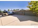 Spacious three-car garage with ample parking space and RV parking at 9539 N 89Th St, Longmont, CO 80503