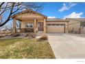 Attractive single-Gathering home with a well-manicured lawn and inviting curb appeal at 175 Redcloud Ave, Berthoud, CO 80513
