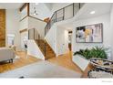 Bright open foyer with modern staircase, beautiful wood floors, and high ceilings at 2167 Jordan Pl, Boulder, CO 80304