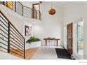 Bright open foyer with modern staircase, beautiful tile floors, and high ceilings at 2167 Jordan Pl, Boulder, CO 80304