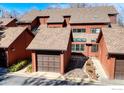 A view of the building's roofline showcasing attached garage and the appealing exterior of the townhome community at 3104 Bell Dr, Boulder, CO 80301