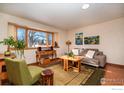 Cozy living room featuring large windows and comfortable furnishings at 3335 Darley Ave, Boulder, CO 80305