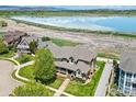 Aerial view of home, showing landscaping, proximity to the lake, and neighboring houses at 3916 Fowler Ln, Longmont, CO 80503