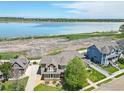 Aerial view of home, with mature trees and landscaping, plus community lake at 3916 Fowler Ln, Longmont, CO 80503