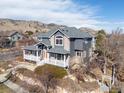 Stunning exterior view highlights architectural details, mature trees, and professional landscaping in this desirable neighborhood at 4860 Fountain St, Boulder, CO 80304