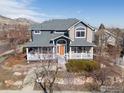 Charming two-story home with a welcoming front porch and mountain views at 4860 Fountain St, Boulder, CO 80304
