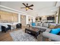 Spacious living room with an open floor plan featuring modern decor, hardwood floors, and an inviting atmosphere at 1015 Auburn Dr, Erie, CO 80516