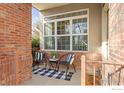 Charming brick porch with seating, perfect for relaxing and enjoying the outdoors at 1333 Charles Dr # 15, Longmont, CO 80503