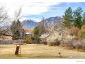 Spacious backyard with a view of the mountains, offering ample space for recreation and relaxation at 2550 Linden Ave, Boulder, CO 80304