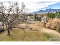 Expansive backyard featuring a large, mature tree, offering privacy and a connection with nature at 2550 Linden Ave, Boulder, CO 80304
