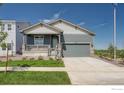 Charming single Gathering home with a front porch and an attached two-car garage with easy driveway access at 2723 Crystal Springs, Longmont, CO 80503