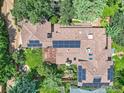 Expansive aerial view of home featuring a deck, backyard, solar panels, and lush landscaping at 3135 11Th St, Boulder, CO 80304