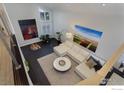 Bright living room with vaulted ceilings, art, comfortable seating and large windows at 3865 Newport Ln, Boulder, CO 80304