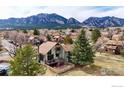 Stunning home nestled with mountain view, mature trees, and fenced yard at 3885 Telluride Pl, Boulder, CO 80305