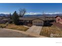 Charming ranch-style home featuring a two-car garage and mountain views at 4825 Devonshire St, Boulder, CO 80301
