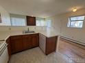 Functional kitchen features wood cabinets, essential appliances, and a breakfast bar with space for seating at 8044 Countryside Park # 220, Longmont, CO 80503