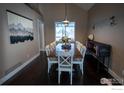 Spacious dining room with a large table and ample seating for entertaining at 92 Kolar Ct, Erie, CO 80516