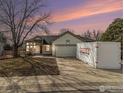 Single story home with natural light, garage and long driveway at 1148 Chestnut Dr, Longmont, CO 80503