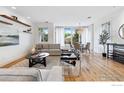 Bright living room featuring modern decor, hardwood floors, and an open floor plan at 1221 Linden Ave, Boulder, CO 80304