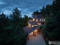 Stunning multi-level home with unique architecture surrounded by lush greenery in a serene, private setting at 15 Arrowleaf Ct, Boulder, CO 80304