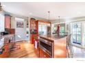 Gourmet kitchen featuring a large island, stainless steel appliances, including a wine cooler and granite countertops at 15 Arrowleaf Ct, Boulder, CO 80304