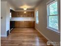 Dining area featuring built-in cabinets and hardwood floors at 150 S Canosa Ct, Denver, CO 80219