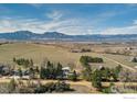 Expansive aerial view showcasing the property's location with mountain views, situated on vast land at 303 Sky Lark Way, Boulder, CO 80303