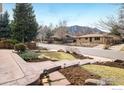 Beautifully landscaped front yard with stone walkway leading to a cozy single-story home at 350 Auburn St, Boulder, CO 80305