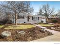 Ranch-style home with well-maintained landscaping and a welcoming walkway, set on a sunny day at 350 Auburn St, Boulder, CO 80305