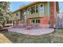 Charming two-story home with a stone patio, perfect for outdoor seating and enjoying the landscaped front yard at 4361 Butler Cir, Boulder, CO 80305