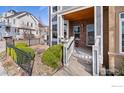 Inviting front porch with brick facade, featuring well-maintained landscaping and a cozy entrance at 555 Laramie Blvd, Boulder, CO 80304