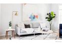 Cozy living room featuring a comfortable sofa, decorative pillows, and a stylish coffee table at 635 Alpine Ave, Boulder, CO 80304